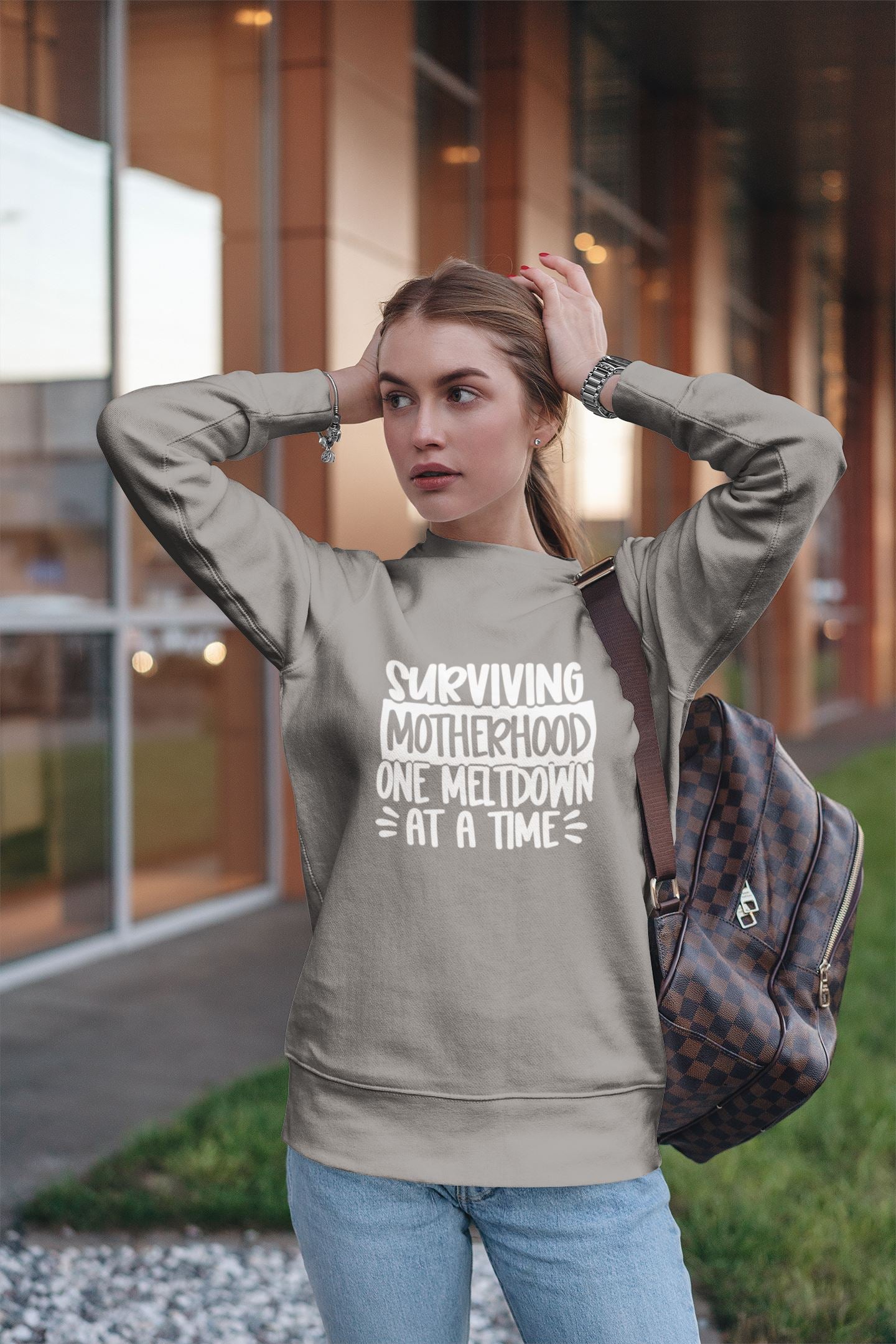 Surviving Motherhood one Meltdown at a time Sweatshirt